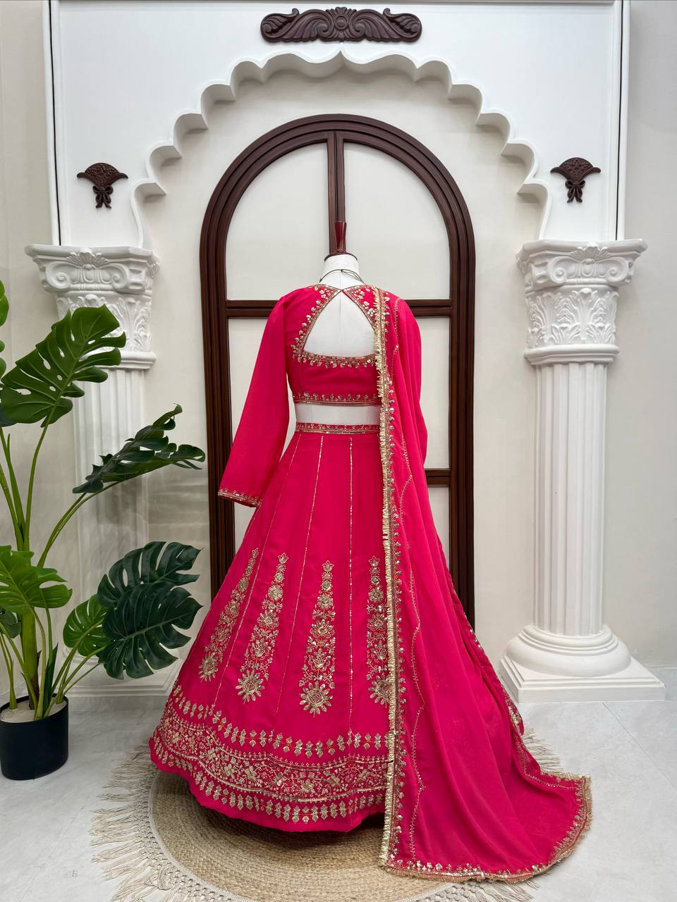 Radiant Rani Pink Silk Lehenga Choli Adorned with Opulent Heritage Floral Motifs and Intricate Zari Borders